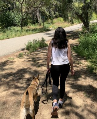Rochelle hiking with her dog.